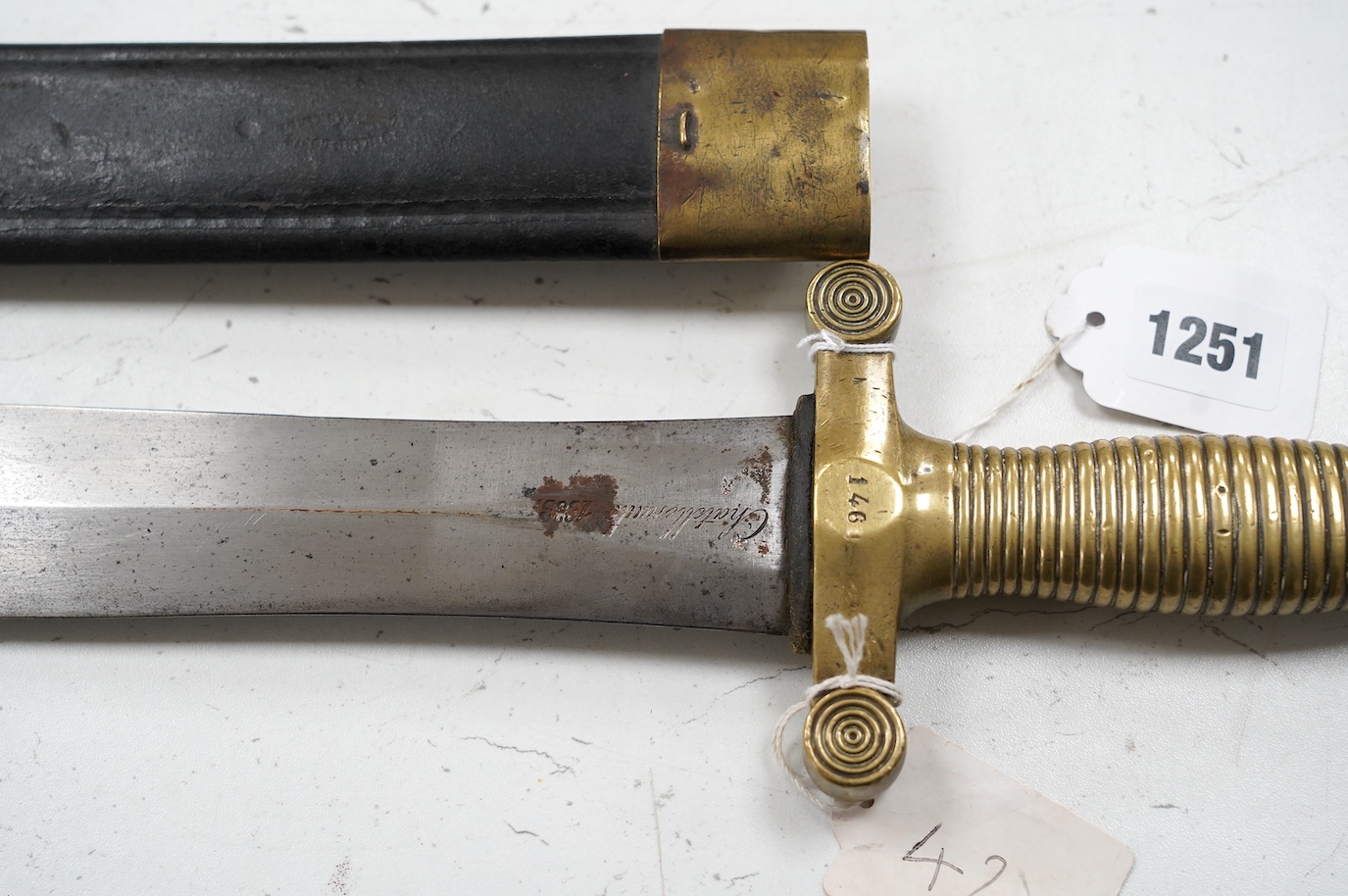 A French Gladius, regulation blade stamped ‘Chatellerault 1833’ in its scabbard, blade 48.5cm. Condition - good